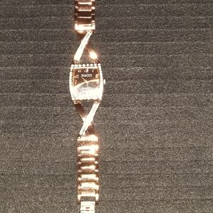 Copper colored bracelet watch with jeweled accents